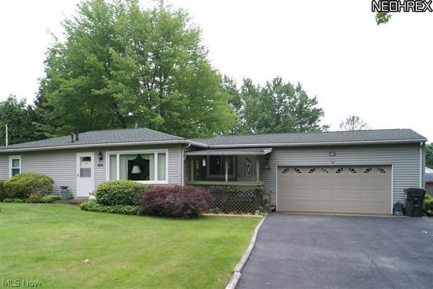 Wonderful setting surrounds this 3 bedroom ranch with attached 2 car garage.  Hardwood floors under carpet in living room and hall.  Hot water tank - 4 years old.  Kitchen laminate floor - 3 years old.  Main bath updated - 12 years. Family room addition - 25 years.  Laundry W & D in kitchen.