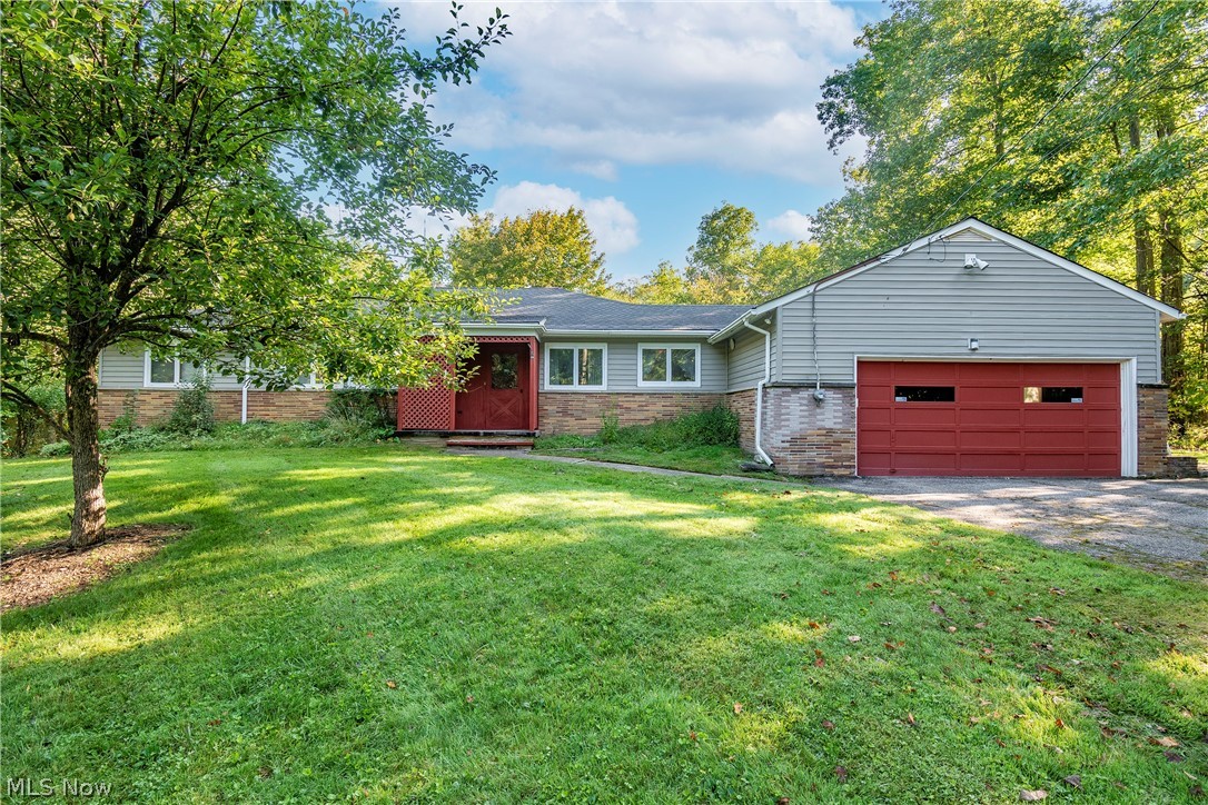 Welcome to 140 Murwood Drive! Sitting on over 3 acres in the desirable Moreland Hills horseshoe, this home boasts serene wooded views and loads of potential! The main level features a kitchen with dining area, an oversized living room, and first floor laundry! You will also find three great sized bedrooms, a full bath, and a half bath. Sliding glass doors grant access to a small patio area. Enjoy your two wood burning fireplaces, one in the living room and one in the rec room on the lower level. Full lower level with loads of storage space. The extended wooded backyard boasts a large outbuilding and a walking path to a pond. Well pump 2021. All new electric and water softener 2020. HWT 2019. Schedule your private viewing today!