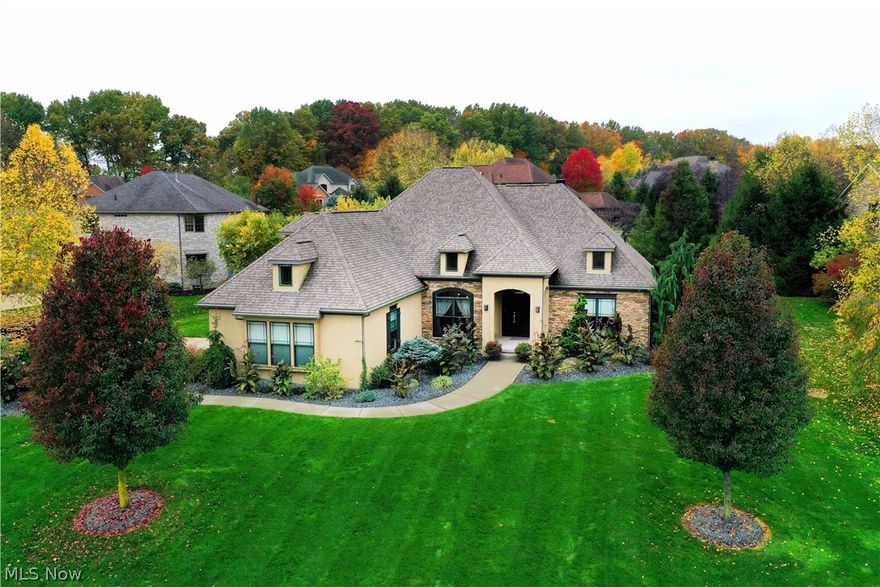 Outstanding custom built home in the Reserve at Emerald Estates.  A contemporary custom-built Memmer Homes timeless design. This magnificent home has 13' ceilings and beautiful bamboo floorings on the first floor. The kitchen is a chef's dream and great for entertaining. It offers detailed decorative backsplash with glass inserts, custom Quartz countertops with waterfall design, GE Profile appliances, a breakfast bar, an abundance of cabinetry, and built-in oven, electric range. This ranch with an open floor plan is a dream for entertaining and opens up to the spacious great room with a gorgeous stone fireplace and access to a wonderful covered patio (14x16). The formal dining room w/big windows overlook the front yard and can be utilized as an office or sitting room. 1rst floor spacious master suite with a walk-in closet (9x11), a must-see master bathroom, walk-in shower with WaterTile® Rain head, freestanding soaking tub, and double sink. The main floor is completed w/two other spaci