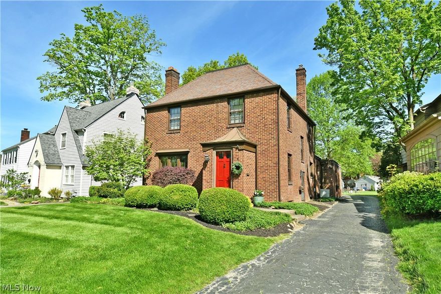 Charming Mahoning Valley Classic is waiting for you. This 1,643 sq ft, two-story, 3 bedroom, 1.5 bathroom brick beauty was built in 1921 & is located in the established Ridgewood Estate neighborhood. The manicured landscaping and curb appeal embraces you the moment you step out of your vehicle. The timeless character is to be appreciated as you are welcomed with a beveled glass interior door, ornate tiled floor in the foyer, large living room w/fireplace all graced with beautiful natural woodwork/crown molding, & beautiful built-ins featuring beveled glass-leaded detailed doors. The character continues into the dining room with chair rail wainscoting, french doors leading to the outside patio and a period appropriate chandelier. The kitchen still showcases the original ironing board closet, all white cabinets and dark countertops, & a cozy dinette that exudes charm. You will enjoy hardwood floors throughout the first & second floor & staircase, except for the full bathroom and foyer where the nostalgic tile is located. The 1st floor half bath is a great perk for you and your guests. On the 2nd floor are 3 spacious bedrooms, wonderful built-ins in the hallway and a bathroom with small penny size octagon white and black floor tile. At the end of the 2nd floor hallway is a door to the outside that holds so much potential for a 2nd floor entertaining, relaxation, or maybe a sunbathing deck, if it is transformed correctly with functionality and safety in mind. The walk-up attic offers great additional storage area. The full-size basement has so much potential & is waiting for your creativity.  Open the dining room French doors to the enjoy the patio for your perfect escape enjoying a cup of coffee or tea, a good book, or an afternoon siesta. The backyard is perfect for you to choose as an area for kids or pups to play, to BBQ and entertain, grow a garden area, or to kick back & relax. Protect your cars or use the 2-car garage as more storage! SCHEDULE A SHOWING TODAY!