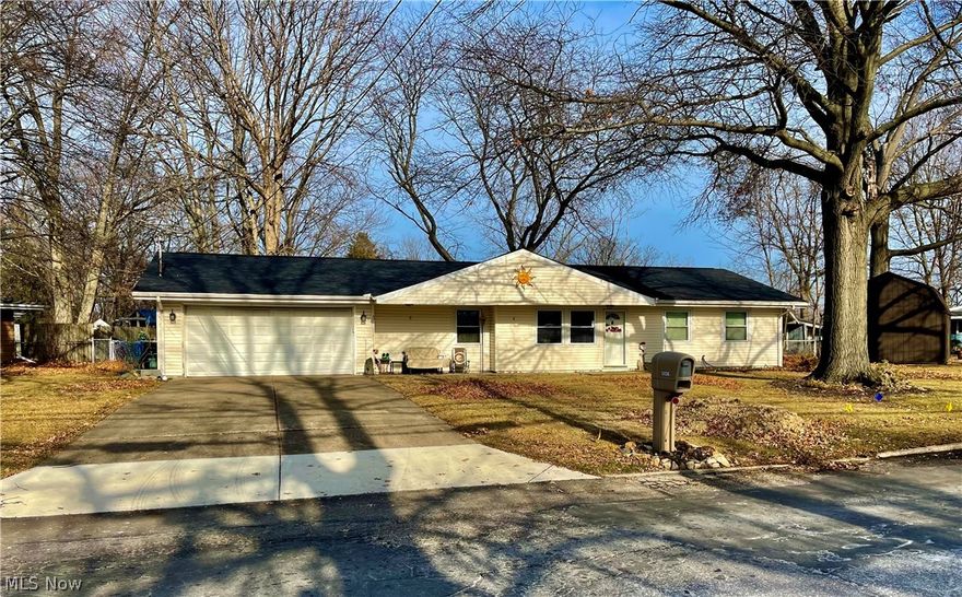 Adorable and affordable 4 bedroom, 2 bath Ranch w/attached extra deep 2 car garage in walking distance to boat slips, beach and schools in the lakefront city of Vermillion.  Open floorpan, Many updates including new roof with complete tear off in 11/22. Updated kitchen with shiplap walls, new fixtures, newer gray cabinets, new counters w/double gray ceramic sink, and kitchen appliances, all about 4 years ago. All appliances stay including washer and dryer. New wide plank Vinyl flooring throughout living room, dining area and kitchen. freshly painted living area and master bedroom, Vinyl siding, replacement windows, central air, large completely fenced in corner lot, new ceiling fans and light fixtures. Pull down storage in garage, freezer, cabinets, and shelving all stay.  Laundry room with plenty of cabinets that can be used as pantry or for more storage. Gazebo w/swing on concrete pad stays, along with grill and two tables in back yard.  Large master bedroom with full bath. In the 2n