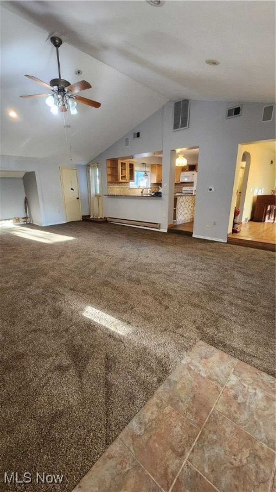 Welcome to this very spacious 3 bedroom, 2.5 bathroom home with ample space for storage and room for families grow. Located in the Boardman school district! Main floor boasts a large great room with vaulted ceilings, fireplace and built in shelving, a kitchen with granite countertops, cork flooring and custom tiles, and a dining room with hard wood floors, bay window and fireplace #2. Down the hall you'll find the laundry room with access to the backyard/patio, and a large master bedroom and full bathroom off bedroom with double sinks and an updated Bath Fitters shower/bath that comes with a transferrable lifetime warranty! Off living room, is access to the 2 car attached garage and front deck where you can sit and enjoy the duck pond! Upstairs you'll find a loft with fireplace #3, two spacious bedrooms and second full bath. 3rd bedroom could be used as a study/office and has built-in shelving and hidden safe in closet! New siding and roof replaced in 2022. Barn has detached workshop and space for extra storage.  Leafguard on all gutters, and a large concrete driveway that allows room for extra parking. Home warranty included! With a little TLC, this could be your next dream home!