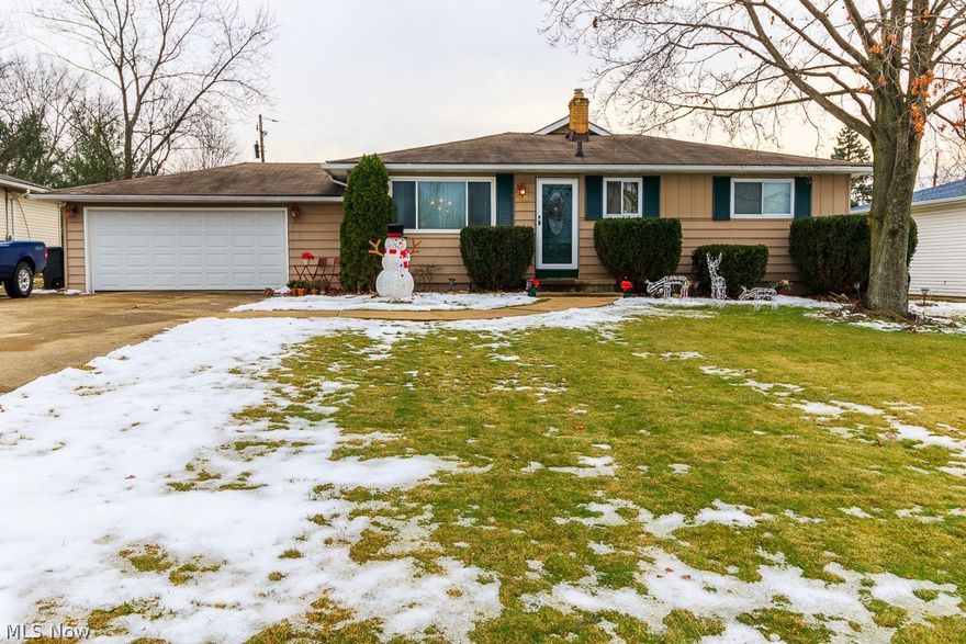Welcome to this charming 3 bedroom Ranch home.  The spacious living room, equipped with triple pane windows (2014) and gas fireplace, is great for large families and entertaining.  A stamped concrete patio off the living room leads to a beautiful, partially fenced yard. Extra living space is provided in the lower level rec. room w/ wet bar. The 2 car attached garage is equipped with 220amp electrical, heat and water. New entry doors and garage door (2014) HWT (2013) A/C (2011). This home is close to schools, park and shopping and comes with a 1 year America's Preferred Home Warranty.
