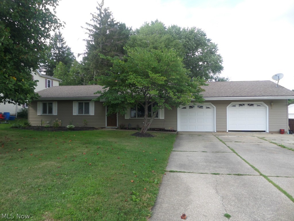 Beautiful expansive ranch in the award wining James A. Garfield school district with a large in-law suite. Recently remodeled with vinyl siding, architectural shingles, newer front door and 2 newer garage doors and carpeting. Large in-law suite with enormous 25x16 family room with cozy gas fireplace that has large bedroom and bath with 100 gallon walk in Premier tub. The in-law suite has access from the main home and from the garage. The garage has a wash sink, garage door openers and drain. Updated kitchen with oak cabinets and has whole house vacuum. Large fenced in backyard for your pets or children to play. Close to shopping, playground and schools. Call me today for a private showing.