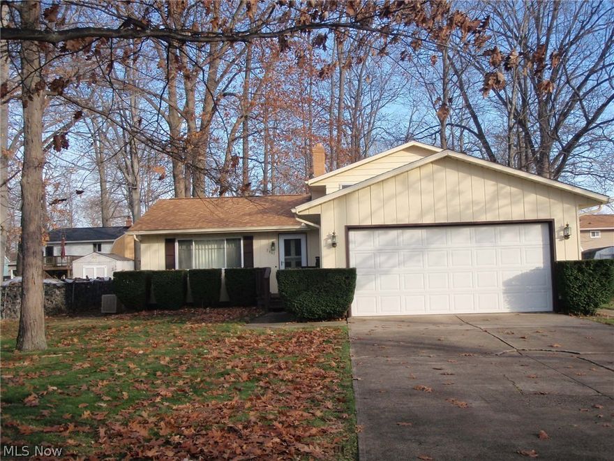 Nice split level with long time home owner.  Many updates that include newer carpeting through out first floor and bedrooms. Granite counter tops in kitchen & bath, newer light fixtures, newer garage door and front door,  faucets, door handles, toliet, tub refinished, newer tile in main bath.  Double closets in master bedroom.  Large lot  fenced in  with shed and patio.  Front deck with bench.  Roof replaced 2008. All kitchen appliances stay (they are newer, dishwasher has not even been used yet)   Washer and dryer also inculded. Crawl space is located behind water tank and furnace. Located on  a cul de sac.