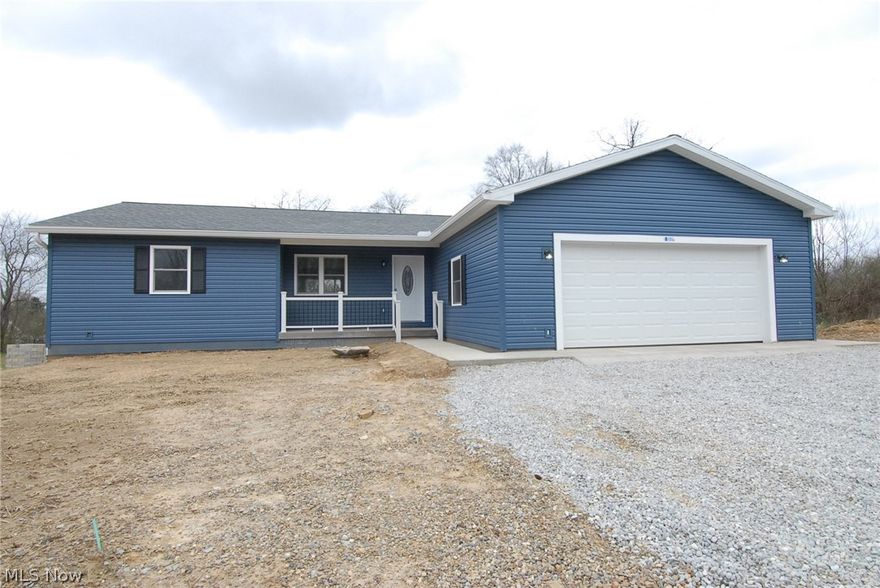 Beautiful blue ranch home built in 2019.  This home offers an open concept living room and eat-in kitchen.  All dark stainless appliances with Granite counter top and back splash.  The large kitchen offers a butcher block island with seating.  The mud room/laundry room is right off the kitchen and 2 car garage.  The split floor plan offers a large master suite with three closets and a spacious master bath with a tub/shower combo.  The other 2 bedrooms each have walk-in closets and share a large full bathroom  with tub/shower combo.  There is large deck off of the kitchen overlooking the large back yard.  The full basement has drywall and is a walk-out.  Great covered front porch.