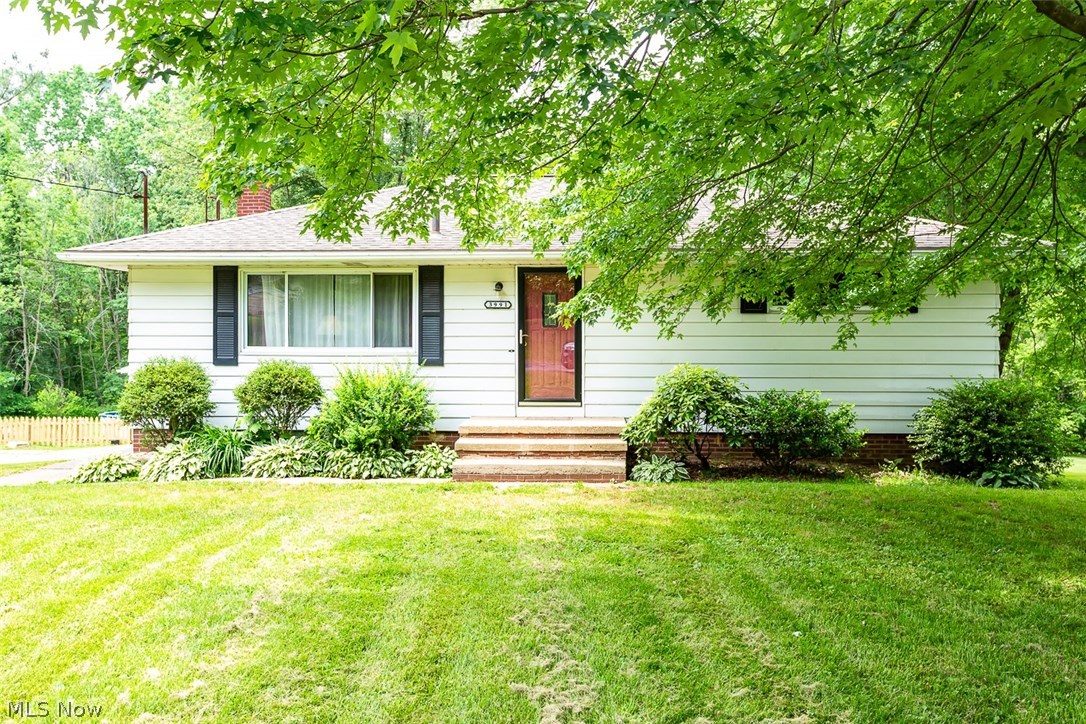 Welcome to 3991 Park Avenue! This split-level in Rootstown’s country-like setting has lots of space inside and out. Step inside to a massive living room with hardwood floors, fresh paint, and lots of natural light. Make your way into the eat-in kitchen with views of the sprawling back yard, new tile floors, and newer black appliances that stay. Down the hall, you’ll find the first bedroom with a large closet. The next bedroom is light and bright, with fresh paint and another big closet. The over-sized master bedroom has plenty of floor space, with a newer ceiling fan, and lots of storage. The full bathroom has been freshly painted and offers a large vanity. Journey downstairs to the walkout basement and discover another full bathroom just off the utility room. A bright room with yard access makes a great office space, and an extra bedroom is perfect for guests! The rest of the basement is just waiting for your creative touch, with new flooring and fresh paint. A great spot to entertain or a new playroom? You decide! A large three car garage with lots of attic storage is attached and leads you to a spacious yard. A separate garage is perfect for storing yard equipment or another vehicle, and the pool area will be your family’s favorite spot all summer long. Additional updates include new pool liner, new hot water tank, and new fencing in 2018. One-year home warranty included for your peace of mind. Don’t miss this hidden gem!