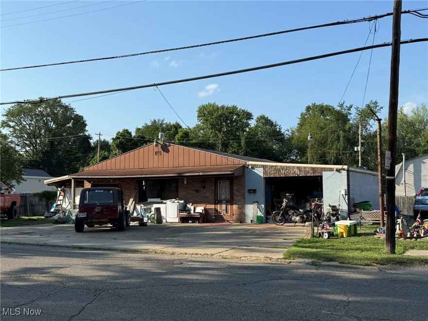 Income opportunity.  Side by side one floor duplex.  1st unit is 2 bedroom, 1 bath with laundry hook-ups and 1 car garage.  2nd unit is 2 bedroom, 1 bath with mud room paying $450 per month plus electric.  Gas range and refrigerator in the 2nd unit stay.  Exclude range and refrigerator in the first unit and the window a/c in the second unit. Tenant occupied, 24 hour notice to show.