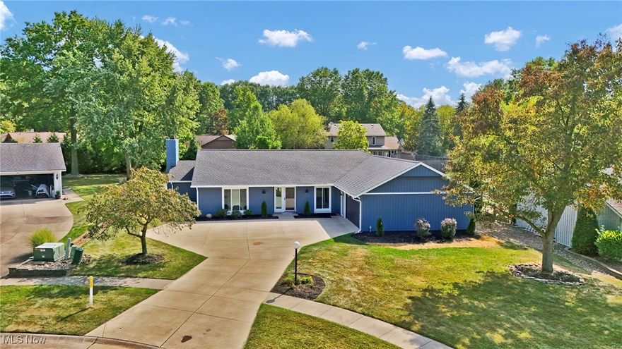 Welcome to this fully remodeled Bob Schmidt home tucked away on a quiet cul-de-sac in Strongsville’s highly sought-after Meadowood community. Step inside to find an abundance of natural light streaming through brand-new windows. The inviting living room boasts vaulted ceilings, a wood-burning fireplace, and stunning floor-to-ceiling windows overlooking the serene backyard.
The kitchen is a true centerpiece, designed for both function and entertaining with all new stainless steel appliances, quartz countertops, soft-close custom cabinetry, and a three-pane slider opening to a brand-new stamped patio with a paver seating wall, perfect for outdoor gatherings. A versatile flex space at the front of the home provides endless options, whether as a home office, playroom, or even a 5th bedroom. In addition, you’ll discover four spacious bedrooms and two full bathrooms, including a generously sized primary suite featuring its own private slider to the backyard, a walk-in closet, and a beautifully updated en suite bath.
Enjoy Meadowood’s various community amenities, including an Olympic-sized pool, tennis courts, and a spacious clubhouse perfect for social gatherings or private events. Recent updates include a new roof, siding, windows, flooring, and garage door. The HVAC system was replaced in 2022, offering peace of mind for years to come. This move-in ready home combines modern updates and exceptional style with timeless comfort in a desirable neighborhood known for its community amenities and convenient location. This is a must see!  Schedule your private showing today!
List agent shares ownership interest.
