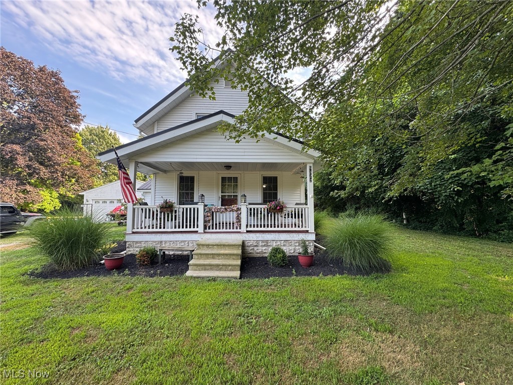 Check out this charming 2 story colonial style farmhouse with a covered front porch and newer metal roof! With plenty of living space this 4-bedroom, 2 bath home sits on close to 4 acres of land. Relax or have gatherings on the cozy front porch. As you enter the spacious living room the beamed ceiling and natural woodwork add great appeal. Notice the wood flooring and just the peace and comfort as you walk through the space. This room leads to the updated Kitchen with newer cabinetry offering plenty of storage and counter space. In addition, all appliances are included. In the dining room the wood floor is featured again. As you dine enjoy the views from the bay window that provides plenty of natural light. A convenient first floor main bedroom with ensuite bathroom makes first floor living a viable option. Easy access to a private rear deck which overlooks the scenic views of the property and acreage. Three upstairs bedrooms with painted wood flooring offers plenty of space for growth. This home has the charm of an older home but includes many updates. The 3-year-old metal roof compliments the home while adding to the curb appeal and character of the home. A full basement offers additional storage and houses the laundry area and mechanicals. Lots of outdoor space to enjoy and take in as you relax on the covered porch or rear deck. The oversized two car garage includes an attached pole building or storage area generating additional space for your toys. This home provides much privacy and room to roam. Great location near Lake Erie, parks, golf course, shopping areas, wineries, and freeway access! Newer roof and leaf guard gutters make for less maintenance. If you are looking for a home with land this could be it.