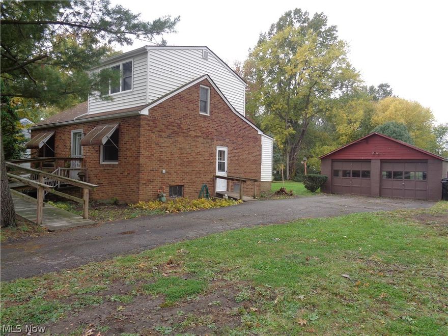 Best bargain in town! Country living in the city with this big beautiful property. This 3 bedroom 1.5 bath brick cape cod is situated on almost an acre in a convenient location of Brook Park. New HE furnace & AC 2013! New hot water tank 2017! Walk in to be greeted by hardwood flooring throughout most of 1st floor. Spacious living area connects the whole home. 2 first floor bedrooms with hardwood floors and ample closet space. Full bath with walk in shower newer commode and 2 vanities. Additional half bath located on the 1st floor as well. Hardwood cabinetry in the kitchen which is off the dining room. Appliances stay! Dining room provides excellent views of your private backyard. Upstairs you will find a 3rd bedroom with tons of closet space. Basement provides additional storage & laundry area. Newer electrical panel! Some vinyl windows throughout home. Large all block 2 car garage! This handyman special is quite the bargain! Stop in today as this one wont last long!