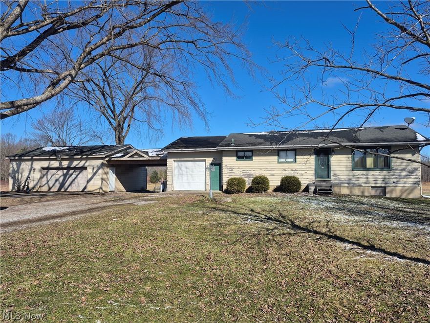 Country ranch offering easy one floor living - kitchen/dining area with oak cabinetry and ceramic tile floors. Living room features hardwood flooring and paneling. Two bedrooms, laundry  room, one bath , full basement, 3+ car garages,
5 acres + pond completes this country charmer.