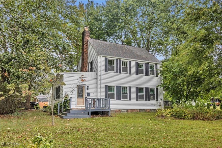 This Colonial in Newton Falls is a must-see. Step inside from the inviting front porch into the welcoming foyer, where a large window, two closets, and a full bathroom set the tone. From here, you can enter the spacious living room through one of two glass-paneled doors. This room features a beautiful brick fireplace, currently set up for gas but easily convertible back to wood burning, an original built-in wooden bench, and elegant French doors that open to the dining room. The dining room flows into a large covered side porch, perfect for family gatherings or quiet evenings outside. The kitchen comes equipped with appliances, ample cabinet space, and convenient access to a side entrance for quick grocery drop-offs and easy access to the garage. Upstairs, you’ll find three well-appointed bedrooms, all with closets, along with a full bathroom and a large hallway closet for additional storage. The full basement offers plenty of space for storage, two laundry room options with both gas and electric hookups, updated mechanicals, and a newly upgraded electrical panel in 2024. The basement has also been previously waterproofed, giving you peace of mind. Outside, the property includes a garden shed, a two-car detached garage with electricity and an automatic opener, and a partially fenced yard perfect for pets. There is still plenty of open space for kids to play or evenings around the firepit. Other highlights include soaring 10-foot ceilings, original hardwood floors and trim throughout and abundant natural light from the many windows. The location is just as special. You are only steps from the river, a few blocks from a neighborhood park, less than half a mile from Newton Falls Waterfall and historic downtown, and about a mile from the Community Center, basketball courts, and baseball fields. Set in a quiet, friendly neighborhood, this home perfectly blends character with modern updates. Don’t miss this amazing opportunity and schedule your private showing today!