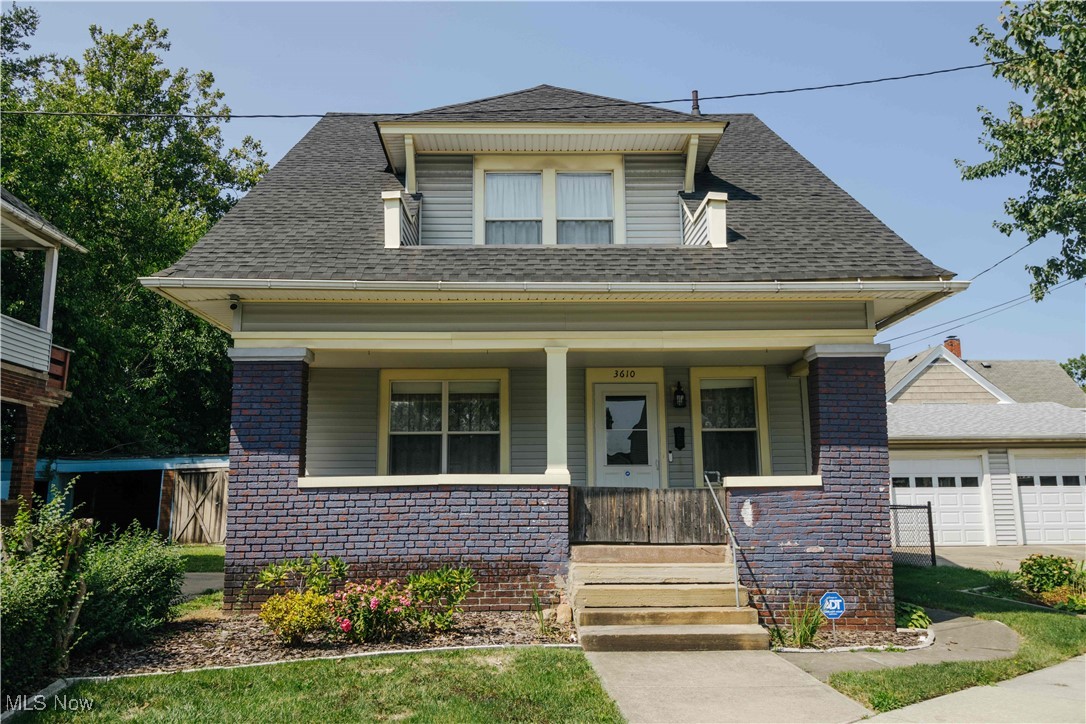Welcome to this lovely Craftsman style brick cape cod! This home features a large living room, dining room with original built in cabinets, blown in insulation, a newer spacious 2 car garage, vinyl windows, radiator heating and new wall mounted heat pump A/C system on the main floor and second floor. The three bedrooms upstairs have large closets and original hardwood under the carpet. The garage would be perfect for tools/woodworking/crafting space and has ample storage. The yard is well manicured and is fully fenced in for furry friends to enjoy! Come check out this gem in a convenient location to all things CLE before it's gone!