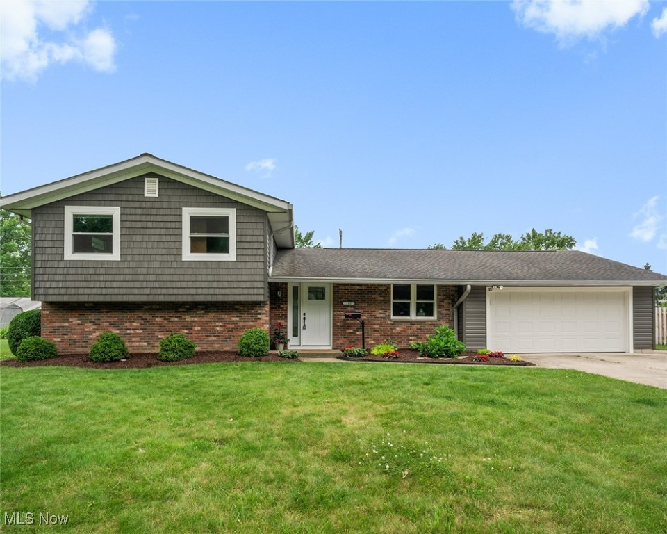 Welcome to 180 Ashwood Drive, a beautifully maintained home with inviting curb appeal on a quiet street. First floor is open and airy, newer luxury vinyl flooring in living and dining rooms, lots of natural light and high ceilings. Eat in kitchen received new appliances in 2023. Lower level features spacious family room with new carpet, half bath and plenty of storage space. Crawl space was waterproofed in 2024. Primary bedroom has attached updated bathroom. Two more bedrooms and additional updated bathroom on second floor. Back yard offers privacy and a large shed. Fresh paint and neutral colors through out the home. Hot water tank 2023, central A/C 2023, electrical panel 2023, siding 2025, windows 2025, external doors 2025. Short distance to Lake Erie, parks, shopping and restaurants. Avon Lake has excellent schools and a quaint community, schedule your showing today!