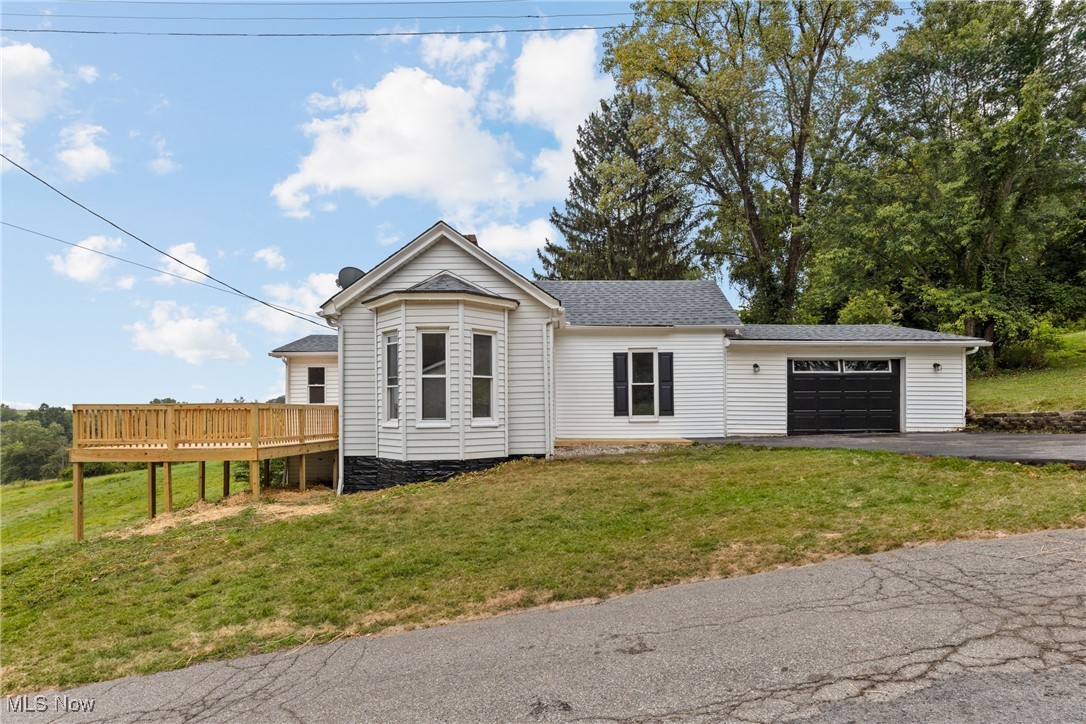 Welcome to 71900 Cope Street in Martins Ferry, Ohio—a beautifully updated home sitting on 1.12 acres of land, offering the perfect blend of modern updates and spacious outdoor living. This 3-bedroom home has been thoughtfully renovated, making it completely move-in ready for its next owner. Step inside and you’ll immediately notice the brand-new flooring that flows throughout the home, giving it a fresh and inviting feel. The heart of the home is the stunning new kitchen, designed with both style and functionality in mind. Featuring sleek new cabinetry, butcher block-style countertops, and brand-new stainless steel appliances, it’s a space ready for everything from weeknight dinners to holiday gatherings. The bathroom has also been fully remodeled with tasteful updates, providing a clean, modern look and a relaxing atmosphere. Each of the three bedrooms offers comfortable living space with plenty of natural light, making them ideal for family, guests, or a home office. Outside, the 1.12-acre lot provides endless possibilities. Whether you’re looking for a large yard for outdoor entertaining, gardening, or simply enjoying a peaceful evening, this property delivers. With so much outdoor space, you’ll have room to grow and create the lifestyle you’ve always wanted. Located just minutes from the conveniences of Martins Ferry and a short drive to Wheeling, this home combines country-like space with the ease of small-town living. With all the major updates already done, 71900 Cope Street is ready for you to move in and make it your own.
