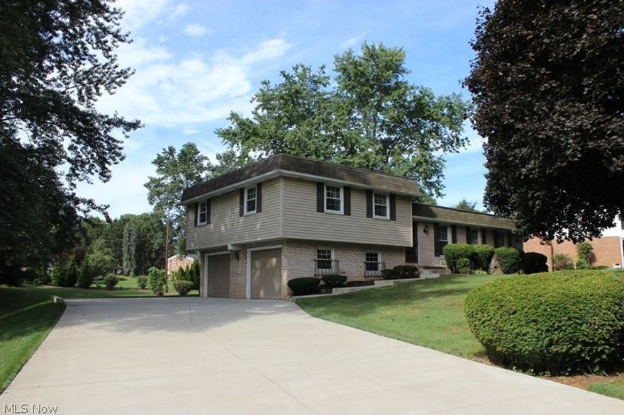 Very well cared for, 1-owner home in beautiful Sherwood Village is ready to enjoy! Original owners of this Bob Lemmon home have updated many items - Driveway, Windows, Roof, Siding, Downspouts, Shutters, Furnace and CAC, Garage Doors and Water Softener. The Brick and Vinyl home sits on a lovely large treed lot with a delightful 3 season Sunroom that overlooks the backyard. You'll enjoy the pretty view each day as you drive past the pond just up the road. The house sits on a wonderful setting with established trees and nice landscaping. Inside offers a great floor plan and room to grow, including a fully applianced eat-in Kitchen, countertop bar area, formal Living and Dining rooms & Family Room w/ fireplace. Master Bedroom has its own Master Bath. Heated and A/C garage and full basement.  Priced below recent neighborhood comps for a fast sale- so you can make your own cosmetic updates to suit your decor. Come see what this home offers.