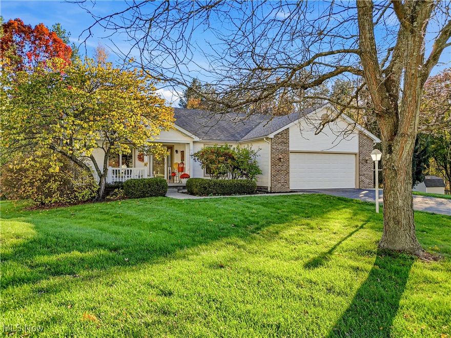 Your search ends here. FABULOUS Austintown Ranch with walk-out basement, tucked along the tree line on a spacious cul-de-sac lot. Tasteful curb appeal with crisp white siding, brick accents, and a covered front porch surrounded by mature landscaping.

Not builder grade—this home reflects thoughtful upgrades and craftsmanship throughout. Impeccable trim, millwork, and custom built-ins highlight the quality construction. Hardwood flooring extends through the main living areas, while a soft, tranquil palette creates a calm and inviting atmosphere with wooded views from nearly every room.

The vaulted great room with brick fireplace opens to the spacious kitchen and dinette/morning room, creating a comfortable and connected main living space. The kitchen features crisp white cabinetry, a breakfast bar, and an oversized dinette/morning room with sliding doors leading to the elevated deck overlooking the private backyard. A formal dining room offers additional space for gatherings.

Split-bedroom layout positions the primary suite on one side of the home, with secondary bedrooms and an additional full bath on the opposite end. The primary suite includes a walk-in closet, private bath, and peaceful nature views.

Walk-out lower level provides ample storage and serves as a blank canvas for future finished living space. Sliding glass doors open to a multi-tier paver patio, hot tub area, and beautifully landscaped yard surrounded by mature trees.

Located in a beautiful development but just minutes to a growing list of retail, dining, and entertainment options right here in Austintown, and just a short drive to the Eastwood Mall Complex and major highways—including the Ohio Turnpike—for commuters to Cleveland, Akron, and Pittsburgh.

For your peace of mind, a one year home warranty is provided with purchase. Ask your agent for details.