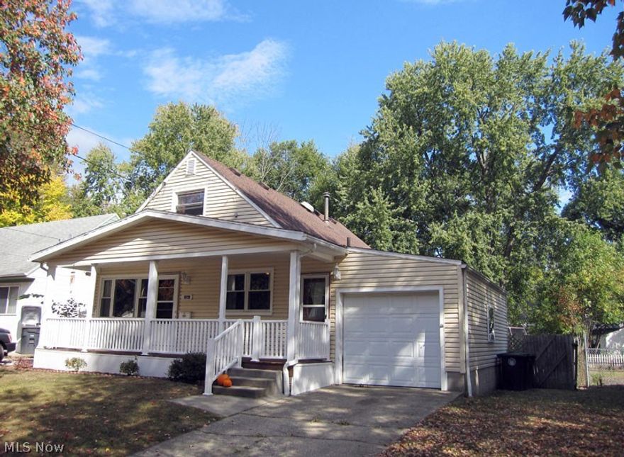 Without a doubt one of the most attractive and charming homes on the street! Cozy front porch, Kitchen is open to living room and dining area. Huge & private completely fenced yard that's pet ready! Street is adjacent to Summit Metro Park hike and bike trail. Newly finished recreation room in 2014 and glass block windows in the basement that has a walk out door to backyard.  Attached garage with opener. All outlets and light switches replaced along with ceiling fans. Recessed canned lighting in kitchen added. All carpet in flooring on the first floor recently replaced. New hot water tank in 2016 entire first floor recently repainted includes a newer shed and picnic table and all appliances stay, a one year warranty is included. Hurry on this beauty!!