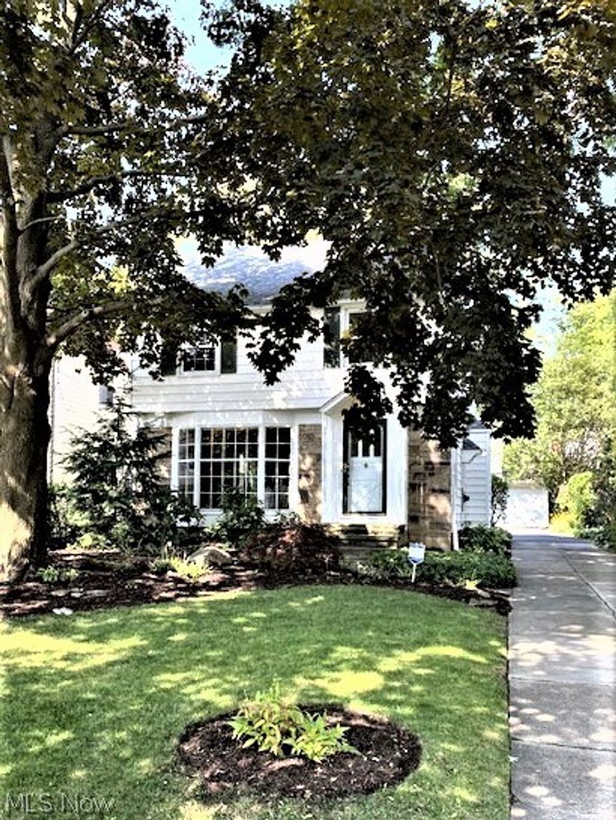 Welcome to Your New Home!! This stately colonial greets you with a warm fireplace, gleaming hardwood floors, impressive cove ceilings and crown molding.  The large bay window in the living room is a cozy niche for relaxing by the fire with a good book, cup of  coffee or a glass of wine. Spacious dining room features a built-in cabinet and opens to the screened in back porch. Brand new luxury vinyl plank flooring showcases the Kitchen, hall, powder room, basement steps and the basement rec room.  You will love cooking in this bright & sunny updated Kitchen! Features include a marble tile backsplash behind the stove, newer appliances, pot rack, cabinets, sink, backsplash & faucet. Check out the pantry cupboard with a tall lazy susan.  Upstairs you’ll appreciate the large bedrooms with a master that opens onto a balcony overlooking the lush backyard.  Bath has been fully updated. There’s also a 3rd floor that can be renovated for another bedroom, office or ‘getaway’ space.  The very clean