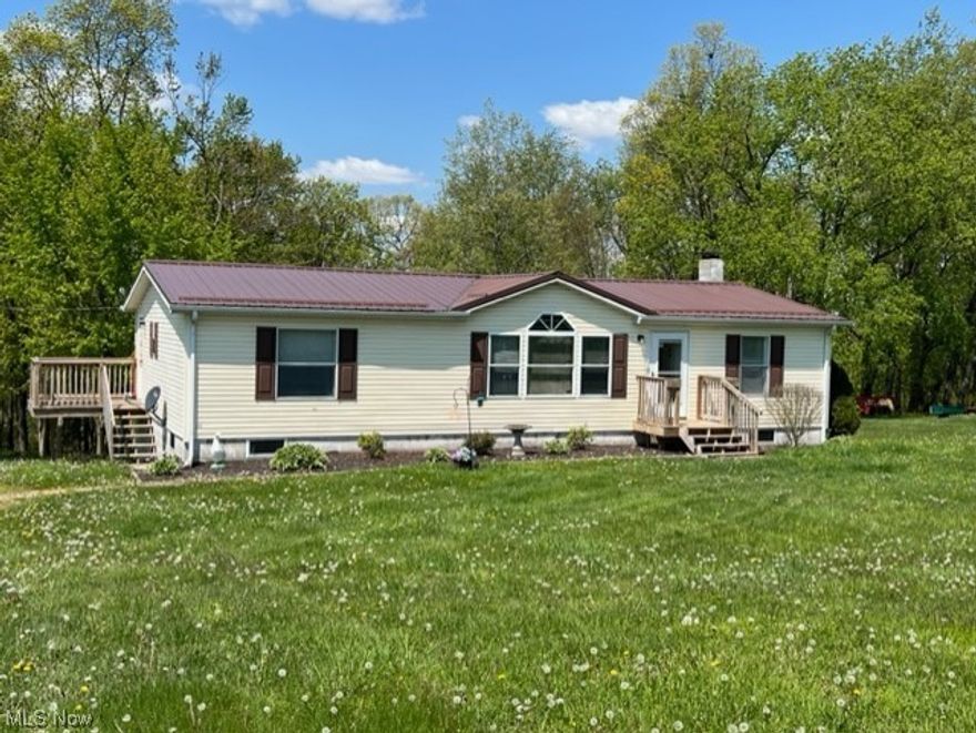 Newer Metal Roof (2 years old), Newer 3 Decks (2 years old), New Roof & Framing on 22 X 14 Shed, Newer Furnace and Central Air, Walkout Unfinished Basement with a full bathroom to be finished. The toliet is working, but the sink and shower need hooked up. Woodburner also in the basement.