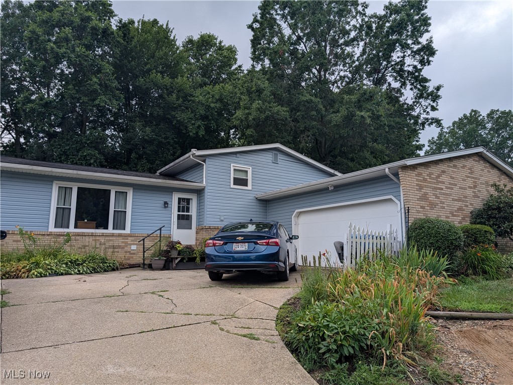 Lots of room in this beautiful 4 bedroom, 2 full bath home located in the Green School district, & conveniently located near almost everything you could ever want. It is time for a new family to make memories here like around the firepit and completely fenced in backyard with gates on both sides of the house. New carpet in one of the bedrooms, new floor in family room July 2025. New drains down the side of the house. Sellers tapped into public water March 2025. Floors have been updated, vinyl siding done, landscaping. This home is all ready for you! Tons of storage in the basement and a small kitchenette. Call your favorite Realtor a.s.a.p. this one will go fast!