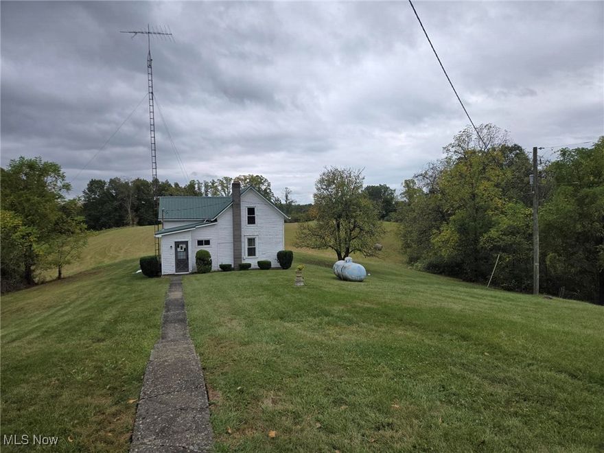 Discover the ultimate escape with this incredible 40-acre property, offering unparalleled privacy and a charming 1.5-story home. Tucked away from the hustle & bustle, this secluded have is perfect for those seeking tranquility or those who are looking for that perfect hunting retreat. This cozy 3 bedroom, 1 bath home provide a comfortable retreat, and also has a handy summer kitchen on the back. You'll find a large barn for all your equipment or livestock plus a 3-car detached garage with a concrete floor & electricity - ideal for hobbies, a workshop or extra vehicle storage. Also nestled behind the home is another storage building with a fascinating secret: a large fruit cellar or bomb shelter underneath offering secure storage or a unique conversation piece. This is more than just a home; it's a lifestyle. Imagine enjoying peaceful mornings exploring your own private acreage and creating lasting memories in this one of a kind setting. Don't miss this rare opportunity to own your very own piece of paradise!