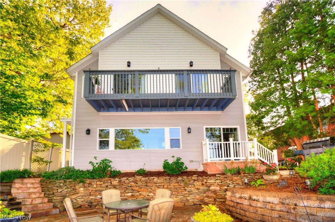 Beautifully rebuilt in 2003. This well thought out design has a welcoming open floor plan and many amenities. Potential for single story living with 1st floor master bedroom, master bathroom, kitchen, dining, living room and attached 2 car garage. Enjoy the main lake views from all areas of this home! A second master suite can be found upstairs and has a vaulted ceiling, private master bath, fireplace, his and her closets and private deck. Gorgeous custom kitchen has granite counter tops and the stove/oven that was imported from Italy. Your fantastic yard and the perfect location. Private, fully fenced yard and you own your dock. The dock / boat lift is 26 ft and 20 ft. Water at the end of the dock is 12 feet. Gas grill on your private patio is plumbed with Natural gas. Do not pass up this custom built opportunity. This beauty will sell quick! Call today for your private showing