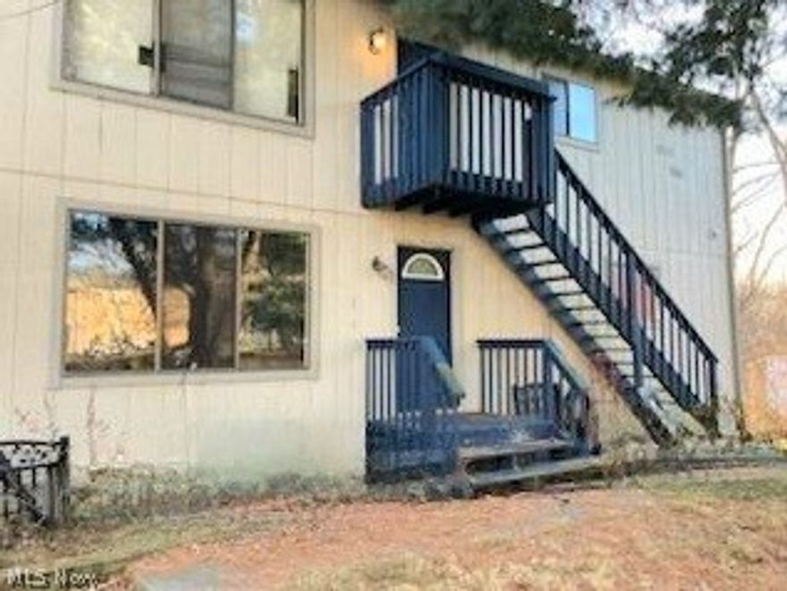 Investment opportunity in Stow.  Up down duplex, convenient location close to everything. Private lot, 4 car attached garage, perfect for storage. Each 2 BR, 1 bath unit, has its own in unit laundry room.  Each unit has a balcony as well and 2 garage bays for storage.  Downstairs unit was updated in 2019.