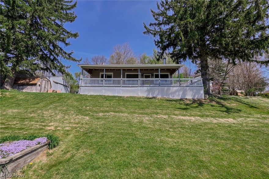 Charming 1-bedroom, 1-bath ranch-style home featuring an open floor plan and breathtaking lake views. Nestled on over a quarter-acre hillside lot, this property offers excellent natural drainage while maximizing the elevated vantage point.

The inviting interior is designed for comfortable living, highlighted by a functional wood-burning stove that creates a warm, cozy atmosphere year-round. Large windows allow natural light to pour in while showcasing the expansive water views.

Enjoy peaceful mornings or relaxing evenings from the covered front porch overlooking the lake. The outdoor space is equally appealing, featuring ample parking, a side-yard fire pit perfect for gatherings, and an outbuilding providing additional storage.

Located in the desirable Guilford Lake area, residents enjoy access to a variety of outdoor and recreational activities including boating, fishing, camping, and hiking. A nearby golf course and casual dining options add to the appeal, making this an ideal location for both relaxation and entertainment.

Whether you're looking for a serene getaway or a full-time residence, this property offers a unique blend of charm, practicality, and scenic beauty.