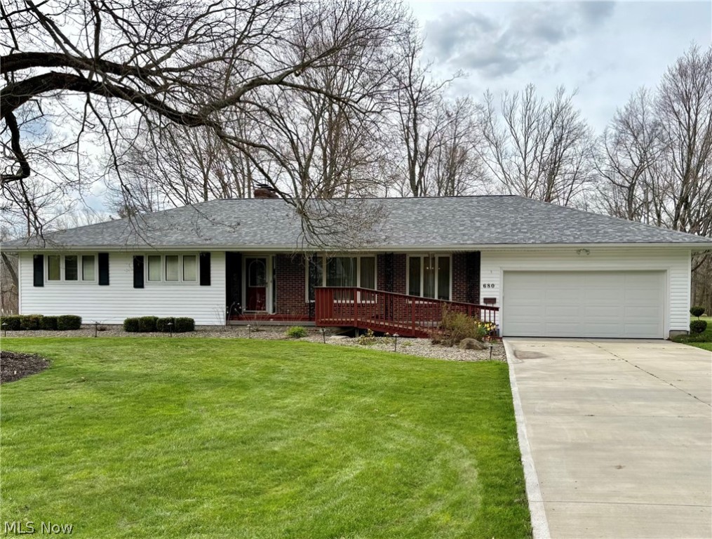 Discover serenity in this charming ranch-style home on a sprawling .92 acre lot in Newton Falls. Boasting three bedrooms and three bathrooms with main level laundry, this residence offers a seamless blend of comfort and functionality. Step into the inviting enclosed sunroom, offering breathtaking views of the tranquil Mahoning River. The expansive basement adds versatility with a convenient bar area, stove and refrigerator, perfect for entertaining guests or enjoying quiet evenings at home.