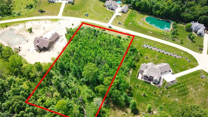 Check out the last lot available in the gorgeous, high-end development Emerald Woods, in York township! This rolling, wooded 2.1 acre lot
has a lovely stream running to the back of the property. Bring your builder and build your own custom home here. The lot has been perc
tested and also has the ability for a walkout basement. The lot has natural gas, city water, septic and all underground utilities. This lot is a
must see, and is waiting for your dream home to be built by your preferred builder!