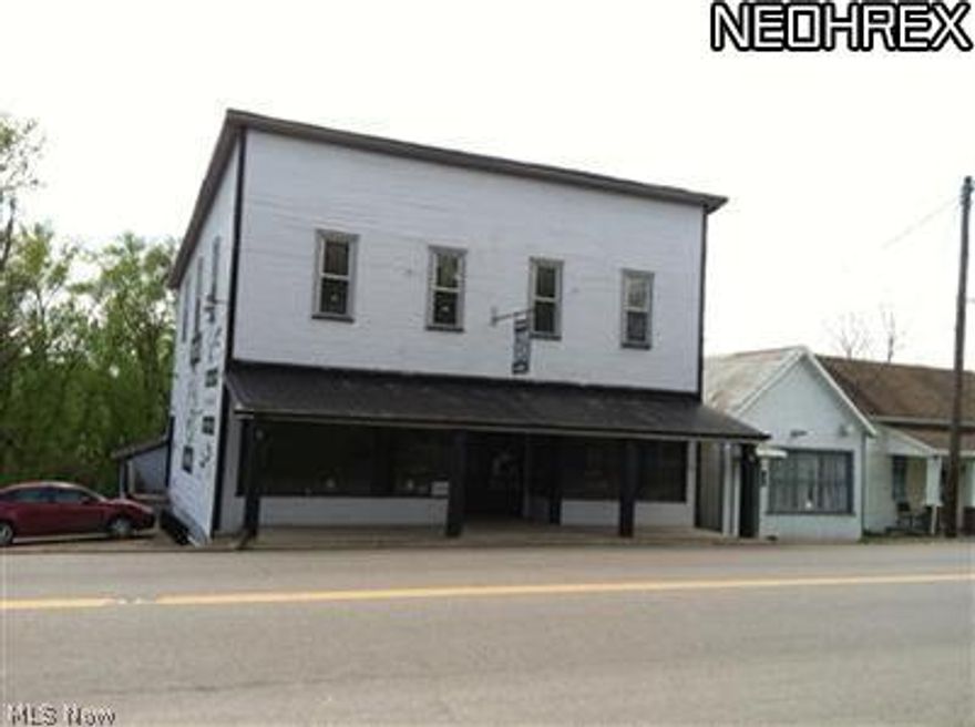 Just off I-77 this spacious commercial building could be used as office, retail, dining or any combination!  Upstairs could be used as apartment rental or owner occupancy. Original wood floors have been refinished, updated electric and roof.