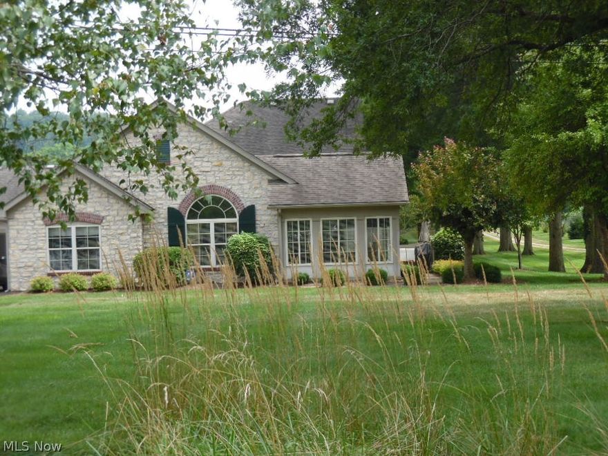 THE WOW FACTOR!! Not just the typical condo!!  This one was customized for its original owner and the current owner did more to make this fabulous one floor living condo DYNAMIC!!! Open and airy floorplan with cathedral ceilings in most of the rooms lends itself to comfortable, contemporary feel. So many upgrades include Hardwood flooring, ceramic tile, master bath remodel with gorgeous tiled shower and glass door, exquisite granite countertops in the kitchen with undermount sink, ceramic tile backsplash and some new appliances.  This condo is the "Canterberry" model which is the largest of the models available at The Fields!  Beautiful location at the front corner, you can enjoy the natural surroundings and landscaping from most rooms.  Don't miss this one!