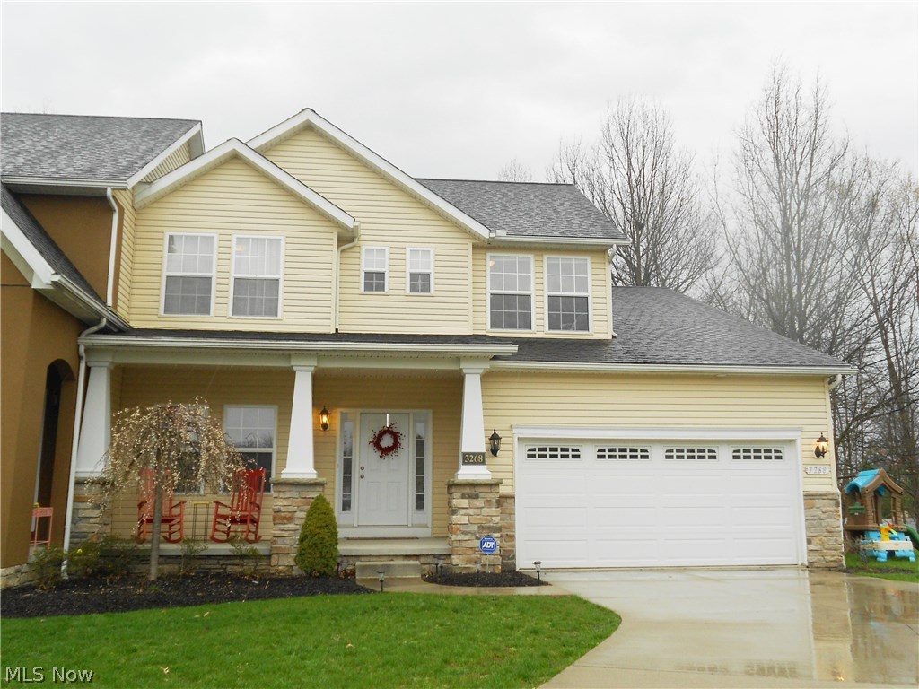 Warmth, beauty, style! Stunning 4 bedroom, 2.5 bath colonial is tastefully decorated and ready for it's new owners. The open floor plan and high ceilings create a comfortable and airy atmosphere. A beautiful kitchen with ceramic flooring offers an eating area and opens to the great room accented by a gas fireplace. Sliders lead to the deck and yard for outdoor enjoyment. Charming french doors open to the convenient first floor office, perfect for business or personal use. The laundry room with sink, powder room and spacious master suite with 7 x 9 walk-in closet complete the first level. Relax and unwind in the lovely master bath with double sinks, pantry, walk-in shower and soaking tub. Upstairs you'll find 3 more bedrooms and a second full bath. All bathrooms and laundry room have ceramic tile floors. This home has a full basement with lots of room for storage and could easily be finished for additional living space. Cuyahoga Falls utilities and Woodridge school district!