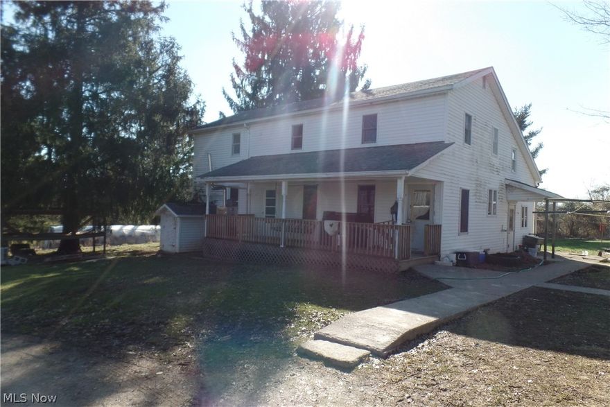 97+- Acres and a farmhouse with several outbuildings and barns. The house is currently an Amish house, so there are no utilities hooked up. This is a picture-perfect farm. 2 large barns, a garden area, and so much more.