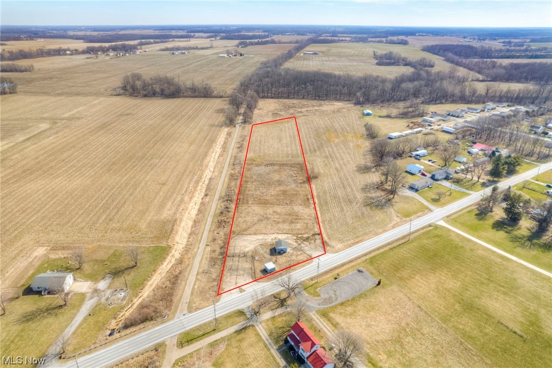 Prime Commercial 4.16 Acre Lot (1 mile west of Summit Motorsport Drag Park) with 215 ft of frontage and 991 ft depth partially fenced with endless possibilities. Easy access to highways. Rear portion of the land is currently being cultivated. Property has a clear EPA report. Owner is aware that electricity is at the street, we are attempting to see what other utilities exist. Land is being sold as it and buyer should complete any needed Due diligence. Call with questions or for additional details.