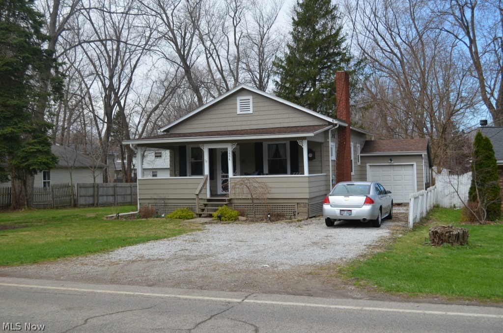 No detail has been missed in this totally updated home. The front porch is welcoming. The perfect spot to sit and watch the world go by. The Living room has new carpet and a cozy fireplace. The kitchen is gorgeous with newer cabinets, granite counter tops, stainless appliances, lighting, and flooring. The bath has been totally updated including beautiful tile surround. There is new carpet throughout and the whole house has been freshly painted. The roof, windows, and HW tank are also newer and the electrical and plumbing were updated. Home also has leaf guard on gutters and blown in insulation in attic. The home even has a newer deck and has been beautifully landscaped. There really is nothing to do but move in! The home also has a pellet stove for the those cold winter night. Very cost effective!! call agent today for your private showing!!