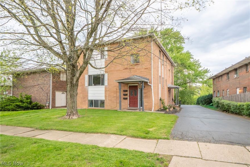 Great investment opportunity in Akron! This brick triplex offers three stacked units, a private driveway, and a detached 3-car garage. The second and third floor units each feature a spacious living room with hardwood floors, a formal dining room, an enlarged eat-in kitchen with appliances, pantry, two bedrooms, and a full bathroom. The lower level unit offers a living/dining area, large kitchen, one bedroom, and an attached full bathroom that also connects to the kitchen. Additional features include forced air gas heat, central air, and public water. Convenient Akron location with strong income potential!