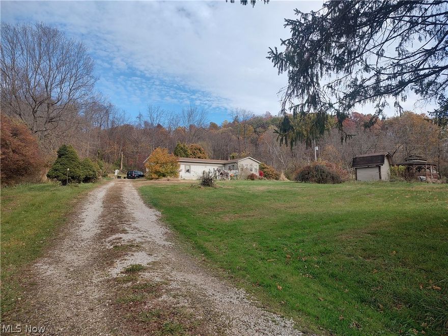 Beautiful and peaceful setting on 6.94 acres. One floor living! 10 x 16 Family room addition with a set of patio doors that lead to the deck. Flooring in living room and kitchen are newer. Furnace replaced in 2025. Shed, gazebo and other outbuildings.