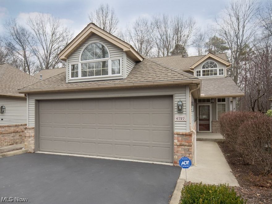 This is a nature lover’s delight. Whether you’re sitting on the front porch or back deck, you’re surrounded by trees at this end unit condo. Black top driveway leads to double car garage with electric opener. Garage has hidden storage overhead. Front entrance leads to the kitchen with gorgeous white oak cabinets and a granite covered an island with built in stove / oven. There is a half bath inside the front entrance. Eating area off the kitchen is open the great room with sky lights. Downstairs master bedroom has a huge walk in closet and an extra large bathroom ensuite. Double sliding doors open to deck surrounded with natural privacy trees. Large great room has a fireplace and double sliding doors bringing in lots of natural light and a relaxing scene of serenity. Loft bedroom has sky lights and a large closet and is equipped with a full bathroom. The loft has a very large hidden storage space. Washer, dryer, stove, refrigerator, dishwasher all stay. Furniture can be purchased.