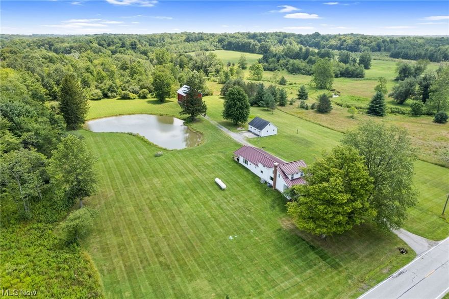 Beautifully Updated Modern Farmhouse set on 10 Peaceful Acres in Bainbridge Twp! This home boasts over 2300 sqft of living space w/3 Bedrooms, 2 Full Baths, warm & inviting open living areas w/new oversized baseboards, new luxury vinyl flooring & carpeting throughout. Foyer entrance welcomes you into the Living Room/Office. Bright & airy vaulted Family Room w/free-standing propane gas stove, new picture windows & slider to covered back porch. Country Kitchen w/abundance of cabinets, breakfast bar, stainless steel appliances & large dining area. 1st floor Master Bedroom w/double closets, custom built-in cabinetry & completely remodeled Master Bath w/new granite vanity, oversized shower & free-standing tub. Second floor includes large loft/sitting area & 2 additional bedrooms. Newly rebuilt staircases to both second floor & basement. 1st flr laundry & full bath. Many major updates & quality improvements include: New metal roof on house installed 2020 & new vinyl siding. Updated electric