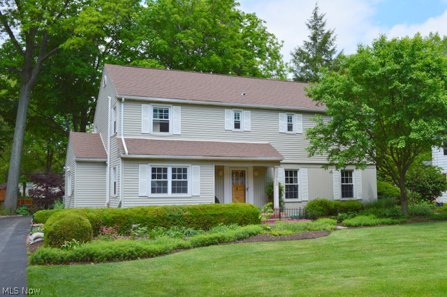 Award Winning Fairlawn Heights colonial offers a comfortable interior and exterior environment with many updates. The three levels of finished living space is a little over 2900 Sq. Ft. The main floor offers a 21 x 13' living room with wood floors, gas fireplace, newer mantle and built-ins (currently photographed in the MLS as the large formal dining room), the bright office with plenty of built-ins overlooks the front of the house while the 24x19' family room with vaulted ceiling & recessed lighting has sliding glass doors that opens up to the back of the house and patio area. The kitchen was updated in 2005 with Cherry cabinets, wood floors, wet bar, granite countertops and black appliances- a wall was removed to attach the kitchen to the original dining room, making this a very open & entertaining space. The second floor offers a large master bedroom with wood floors, attached full bath and three other comfortable bedrooms. This level also includes a main bathroom that has