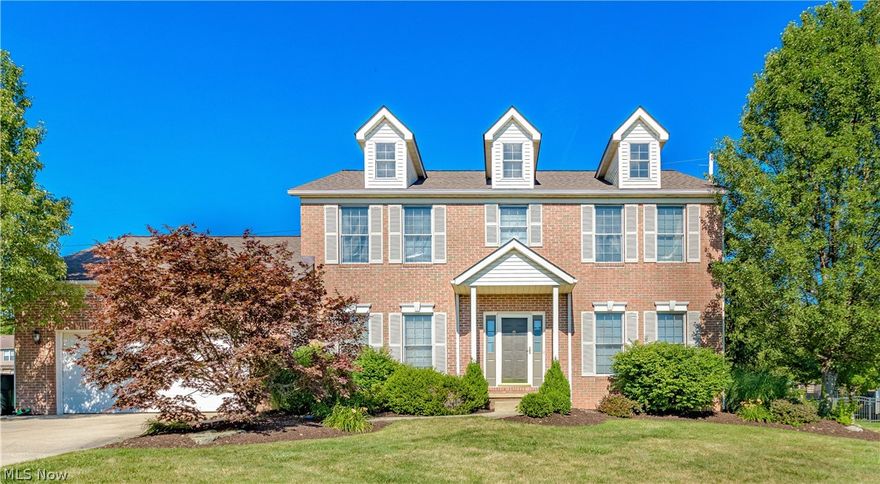 Stately brick front Colonial situated on a cul de sac located  in the  desirable Bayside Lakes community. The large foyer leads to the impressive open concept  plan with 9 foot ceilings on the first floor creating spacious yet comfortable living. Gleaming wood like floors continue through the bright eat in kitchen with a breakfast bar, built in desk, newer granite, back splash and stainless appliances. It's easy to entertain here as the eating area continues into the family room with decorative columns and a gas fireplace. First floor office with french doors and a formal dining room too. Completing the first floor is the  laundry/mud room, walk in pantry and 1/2 bath. Upstairs you'll find 4 spacious bedrooms and two full baths including the vaulted master suite with double sinks, a garden tub plus a shower. The finished lower level is amazing with approximately 1300 more square ft of finished living space including a second fireplace and mini kitchen. The backyard offers room to run w