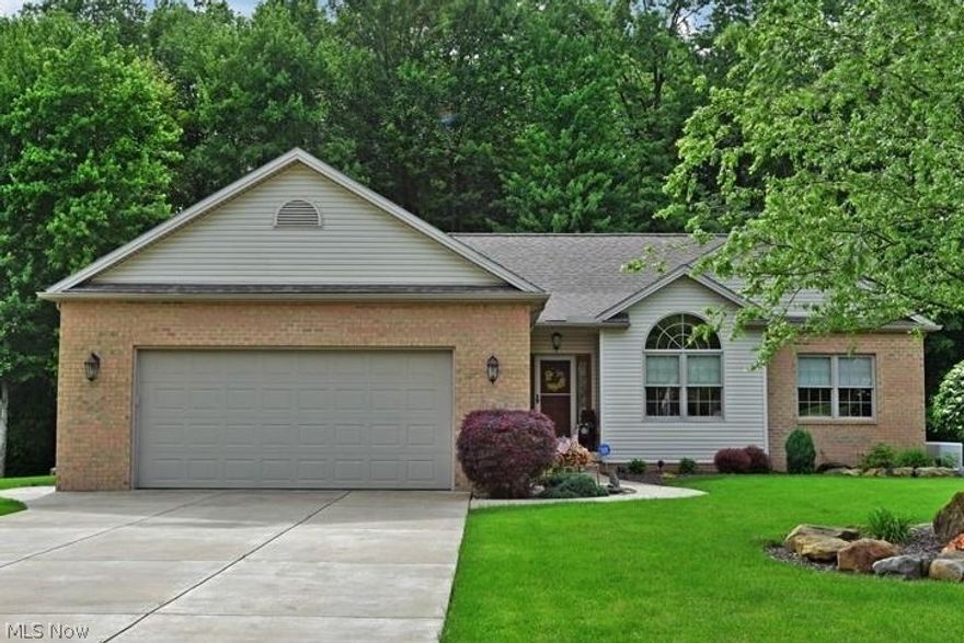 TOP-NOTCH QUALITY in this meticulously designed and custom built ranch on a prime lot against the 100-year bird sanctuary. Beauty
and function work hand-in-hand with the utmost quality, so this is not the typical ranch in Howland. The vaulted great room provides
the perfect place to relax or entertain. Oak trim, doors, and cabinets throughout with the kitchen featuring roll-out shelves, hidden
garbage drawer, baking and spice drawers. All rooms are handicap accessible with extra wide hall, 36" or double doors w/ handles that
are also handicap accessible, and all wall height is 9' or higher. Sliding doors from the great room and the master lead to a two-tier
composite deck overlooking the professionally landscaped lot with wired landscape lighting and the wooded bird sanctuary. The oversized garage features built-in cabinets with counter and staircase to the 13 course basement w/ waterproof seal lock paint on walls, work
shop, with water pressure back-up sump pump, Trane gas furna