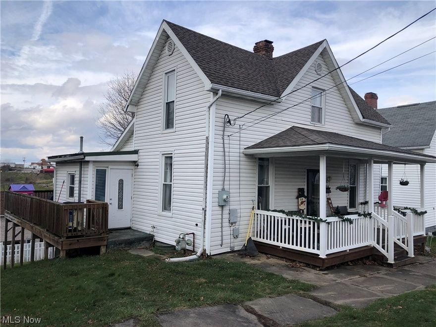 Updated is the best way to describe this one. Including doors, windows, siding, roof, covered front porch, large rear deck, 200 amp breaker box. On the first floor you will find the living room, kitchen, laundry room, bathroom and bedroom. On the second floor you will find two more bedrooms and bathroom with claw foot tub. Kitchen features new sliding glass door that leads to the large rear deck. Deck wraps around to the laundry room door. Enjoy sitting in your rocking chair on the covered front porch.