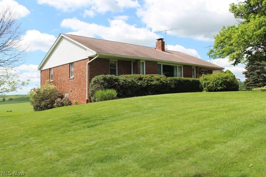 The difficult to find home in the Garaway School District is now available and ready for immediate occupancy at closing. Only a short 1 ½ miles east of Sugarcreek and conveniently placed for good access to I-77/Dover. Move in and create memories in this comfortable brick ranch home featuring full basement with outside entrance, large open area with fireplace, 3/4 bathroom, utilities area, and laundry. Nearly 1,700 sq ft living area on main floor has large living  room with an accented cherry paneling wall, roomy bedrooms, and hardwood floors under the carpeting, plus steps to the attic storage. 1 acre features mature landscaping and beautiful uncrowded open farming valley views, long corn fields, snd open spaces.  A good buy, act while its available!