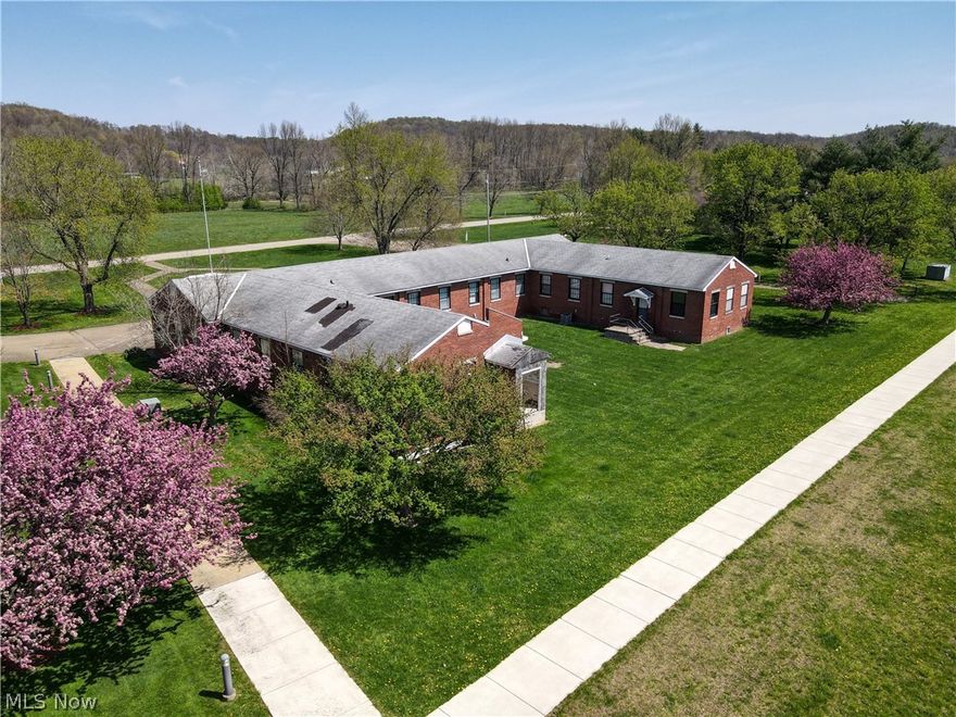 A great opportunity to own your own office space or lease out as an investment. 5900 square foot building sitting on over an acre just minutes from town. Handicap accessible with 14+/- units that could be office or sleeping quarters. 2 full and 1 half bathrooms, laundry area, and kitchen that could be expanded to add dining space. Lots of storage space. Two conference sized rooms could be recreational/media/dining etc. Call today to schedule your personal tour!!