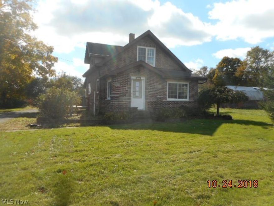 Move in ready 2 bedroom, 1 bath brick home on 1.5 acres.  First floor laundry and bath.  Newer windows, nice wood floors.Full basement and 2 large outbuildings 20x60 and 20x27. Priced "as is" to sell. The well on this property needs to be replaced. This is the reason for the reduction in price