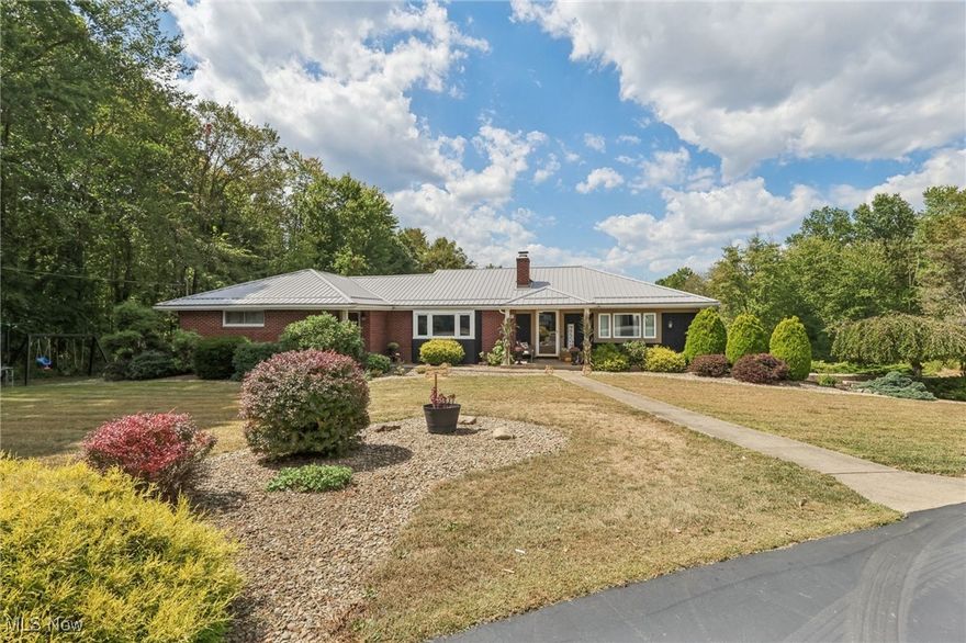 Welcome to 737 Moore Lane!
This spacious home sits on a .708-acre lot with beautiful landscaping, a paved driveway, and the privacy of a dead-end street. Step inside to a stunning 720 sq. ft. great room with new carpet, filled with natural light, perfect for entertaining. The updated kitchen features black butcher block countertops, tile backsplash, new cabinets, LifeProof vinyl flooring, and all-new appliances.

The living room showcases original hardwood floors and a gorgeous stone fireplace, while each bedroom also offers hardwood flooring. Both bathrooms have been fully renovated with modern vanities, tiled showers, updated lighting, and new flooring.

The lower level is open with ceramic flooring, providing endless potential for additional living or recreation space. Outside, enjoy a two-car garage, a concrete patio with an overhead deck, and a newer metal roof.

Upgrades include block windows, a retaining wall, updated lighting, new basement drywall, a water softener, and concrete walkways, just to name a few. Seller will also include a home warranty valued up to $950 for added peace of mind.